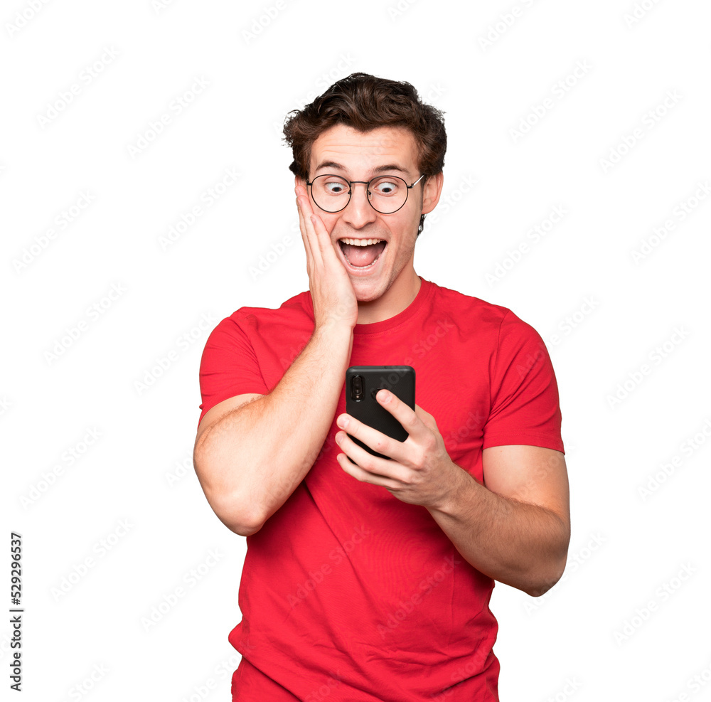 Angry young man using a mobile phone Angry young man using a mobile phone