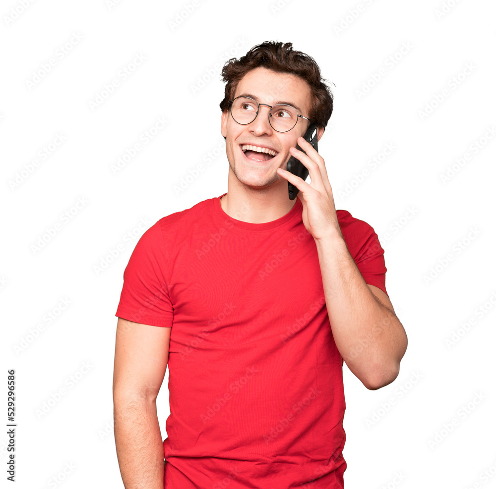 Happy young man using his mobile phone Happy young man using his mobile phone