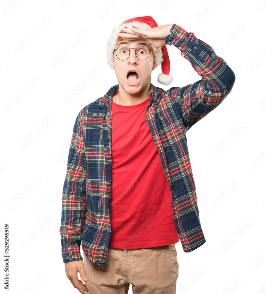 Young man at Christmas doing gestures Young man at Christmas doing gestures