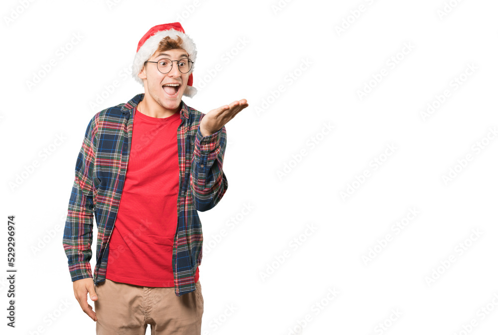 Young man at Christmas doing gestures Young man at Christmas doing gestures