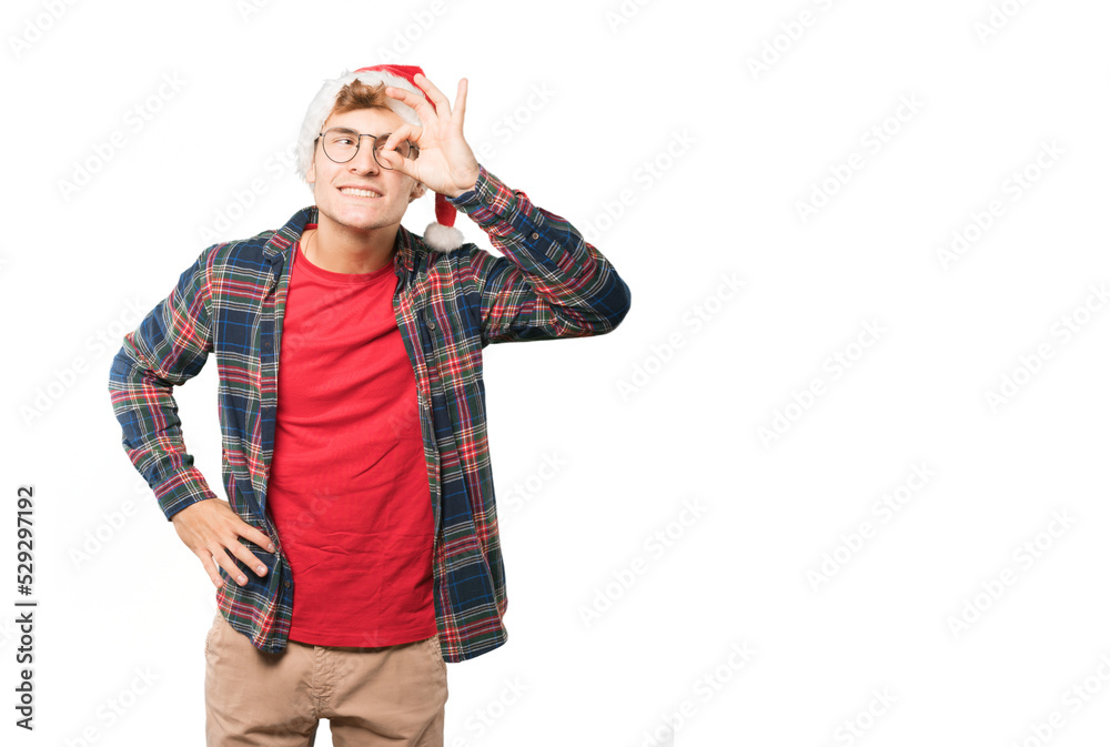Young man at Christmas doing gestures Young man at Christmas doing gestures