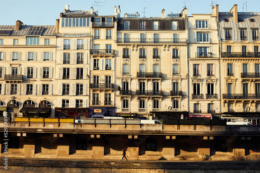 Morning cross river view of Haussmann buildings on the river bank of  the Seine in Paris