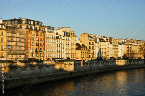 View on the bridge of the Seine, Haussmann buildings in morning Paris