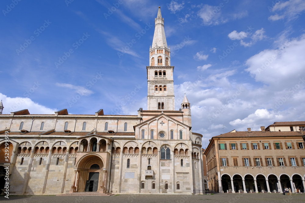 Modena, Italy: View of the Cathedral and the hanging tower of the Ghirlandina antique market on Piazza Grande. The bell tower of the Cathedral of Modena, in Emilia-Romagna. 
