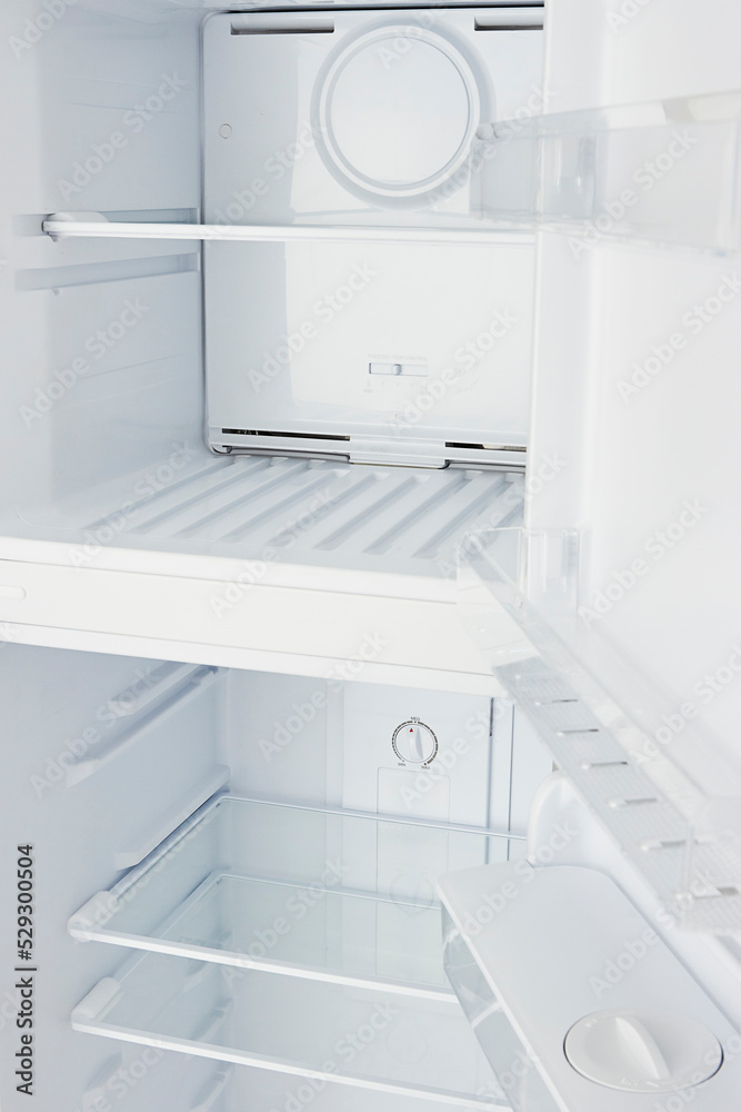 Close up of an empty refrigerator open. New white freezer. Close up of an empty refrigerator open. New white freezer.