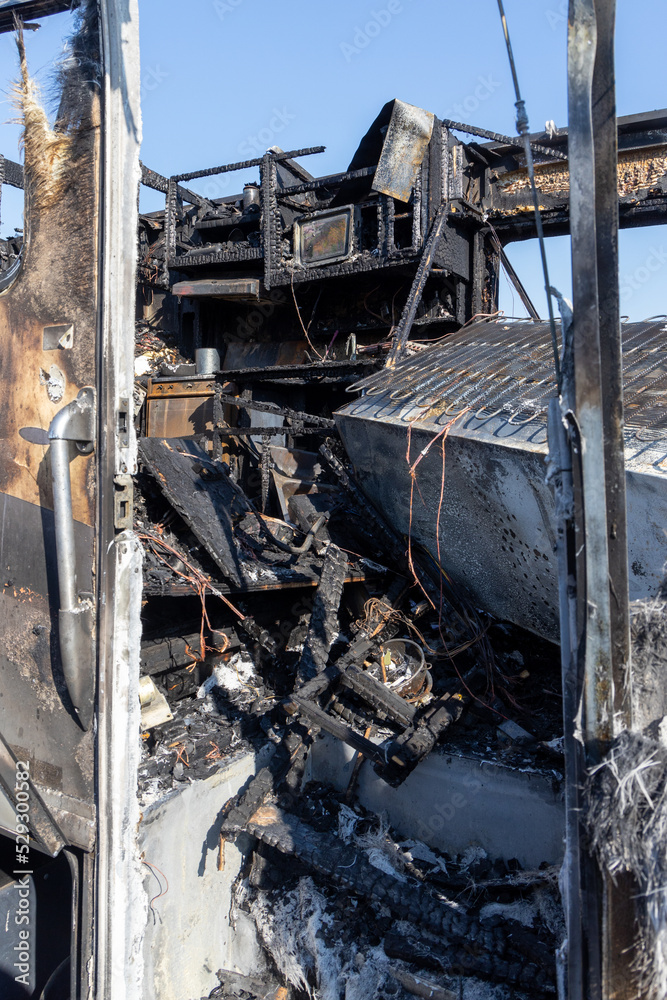 Burned out RV motorhome interior from a fire or explosion or fire bomb or arson shows the melted interior and the devastation of the accident.