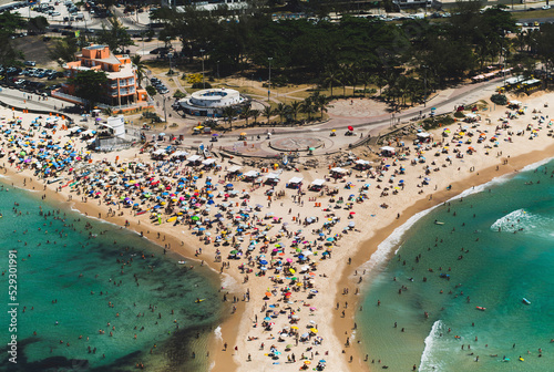 Aerial view of people enjoying at beach in city photo