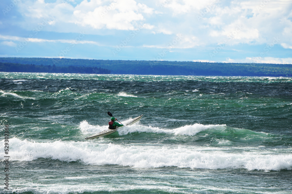 Kayaker Paddling in Waves of Lake Superior