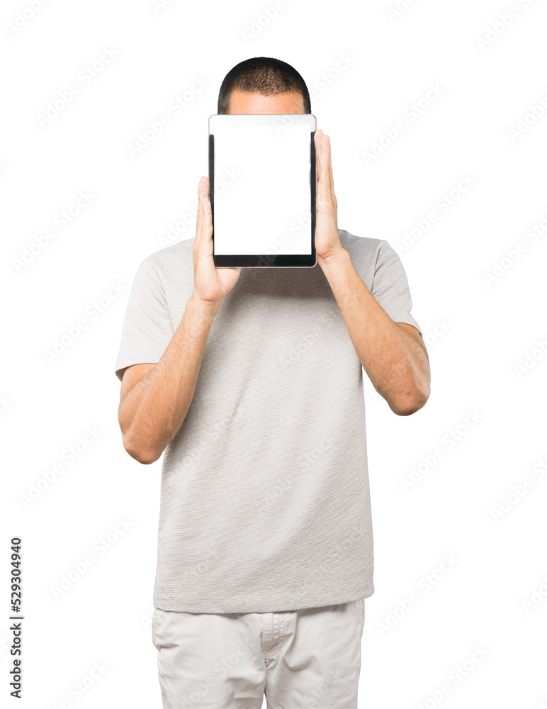 Young man doing gestures using a tablet Young man doing gestures using a tablet