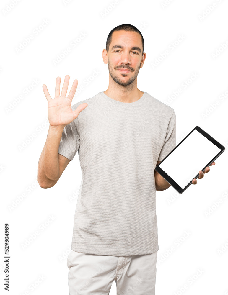 Young man doing gestures using a tablet Young man doing gestures using a tablet
