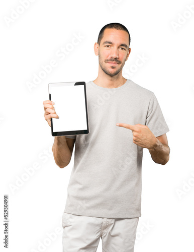 Young man doing gestures using a tablet