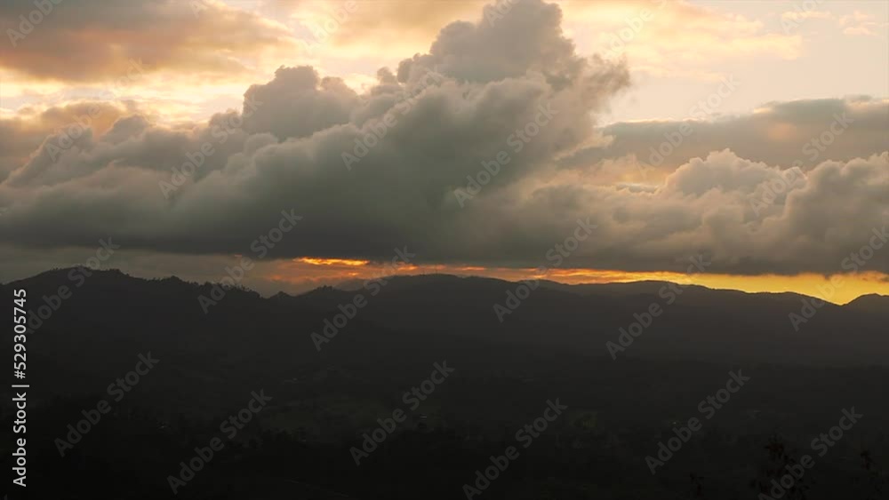 Panoramic shot of a sunset sky over the mountains with misty forest. Beautiful scenery Panoramic shot of a sunset sky over the mountains with misty forest. Beautiful scenery