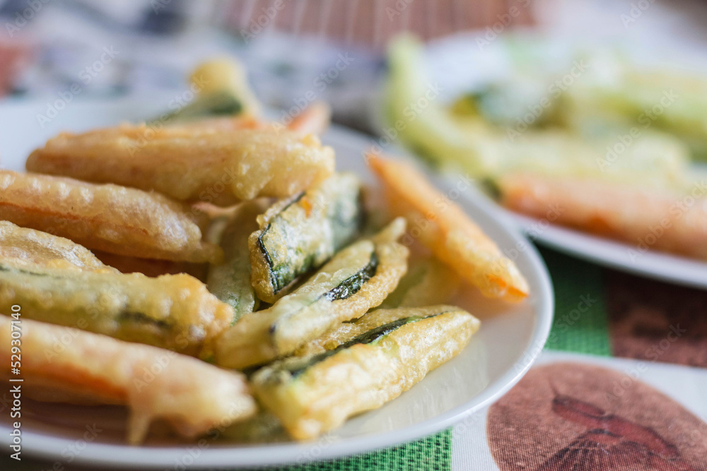 High angle close-up of vegetable tempura served in plate on table High angle close-up of vegetable tempura served in plate on table