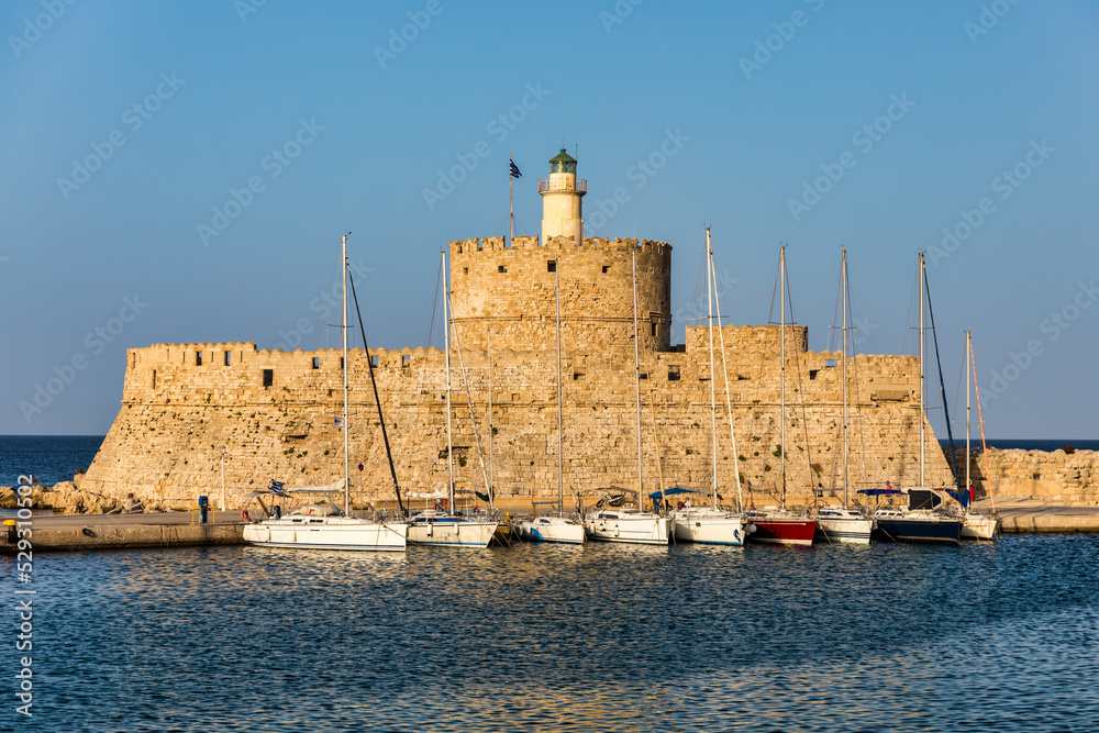 Panoramic view of Rhodes old town on Rhodes island, Greece. Saint Nicholas Fortress cityscape with sea port at. Travel destinations in Rhodes, Greece.
