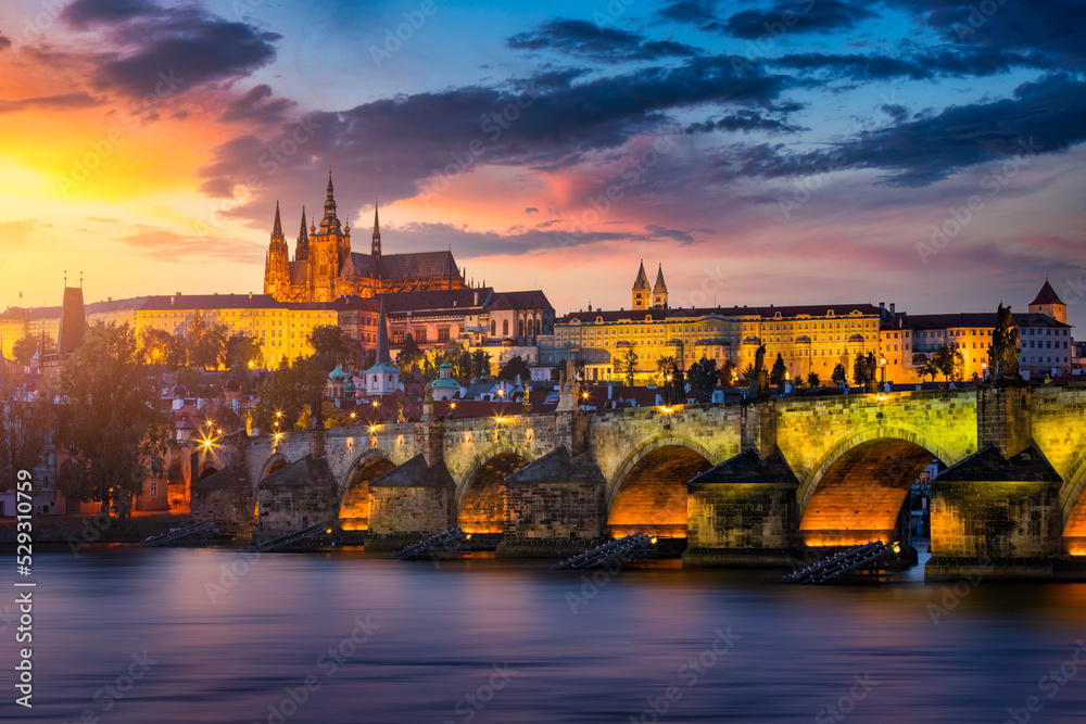 Charles Bridge sunset view of the Old Town pier architecture, Charles Bridge over Vltava river in Prague, Czechia. Old Town of Prague with Charles Bridge and Castle in the background, Czech Republic.