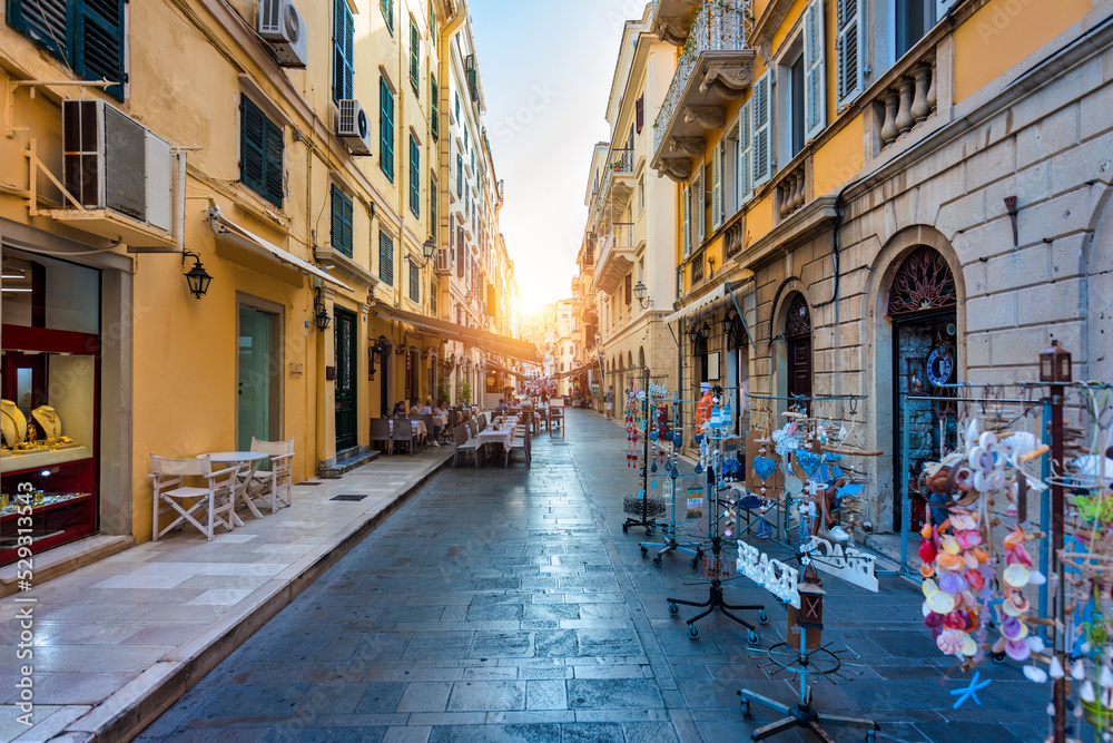 Obraz premium Street view of Kerkyra, capital of Corfu island, Greece. View of Kerkyra with beautiful buildings during summer sunny day. Corfu island, Greece.