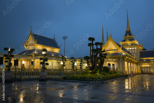 Illuminated royal crematorium against cloudy sky at dusk