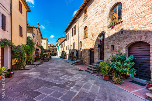 Cozy street decorated with colorful flowers  Pienza  Tuscany  Italy  Europe. Narrow street in the charming town of Pienza in Tuscany. Beautiful streets of the small and historic village Pienza  Italy