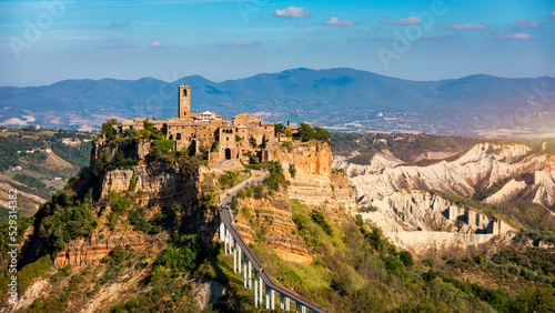 The famous Civita di Bagnoregio on a sunny day. Province of Viterbo, Lazio, Italy. Medieval town on the mountain, Civita di Bagnoregio, popular touristic stop at Tuscany, Italy.