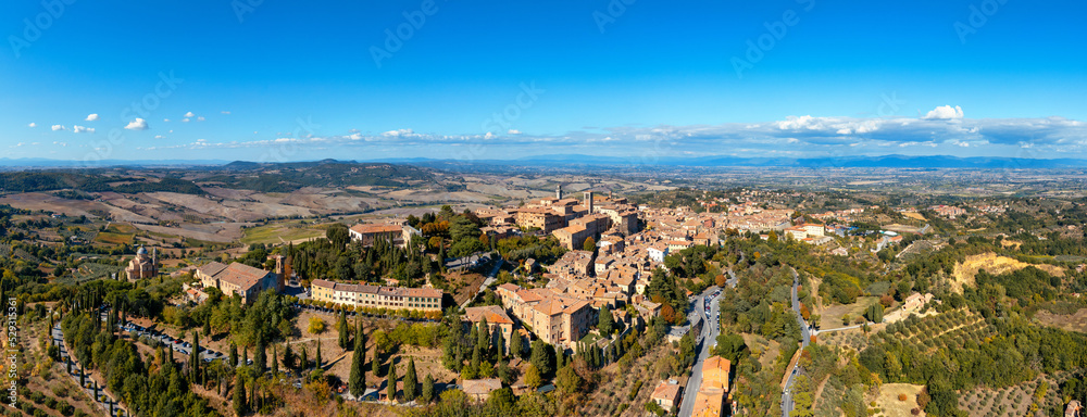 Fototapeta premium Village of Montepulciano with wonderful architecture and houses. A beautiful old town in Tuscany, Italy. Aerial view of the medieval town of Montepulciano, Italy