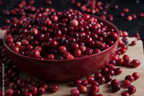 Close-up of fresh cranberries in bowl on table photo