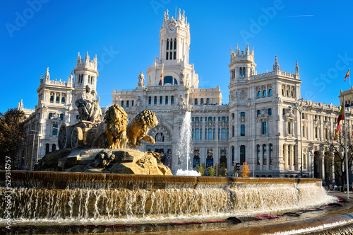 Cybele Palace against clear blue sky in city during sunny day photo