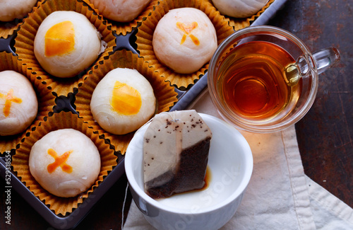 Close-up of tea cup with Chinese cake photo