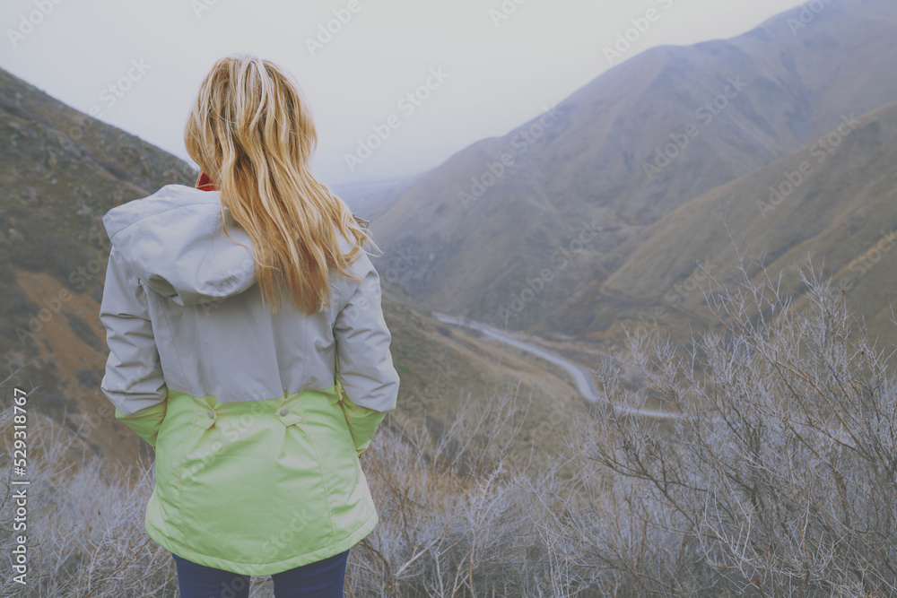 Woman travelling in the foggy mountain area Woman travelling in the foggy mountain area