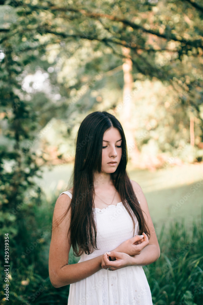 portrait of a brunette woman in the forest portrait of a brunette woman in the forest
