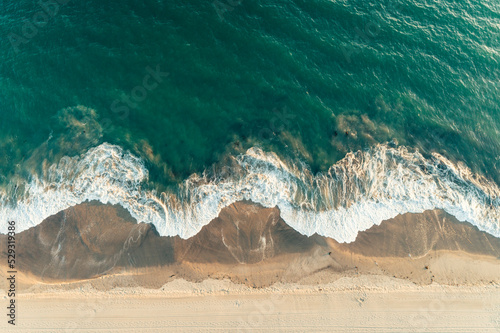 Aerial Drone Photo Of Waves On Beach photo