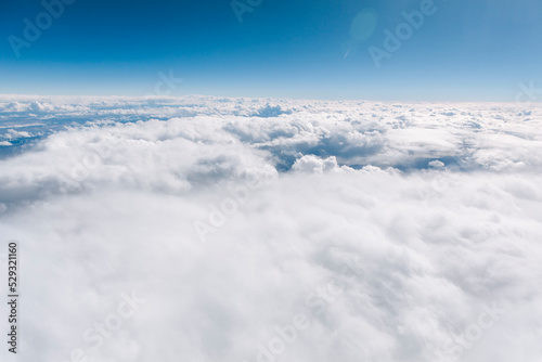 A sea of soft clouds cover the sky on a sunny afternoon photo
