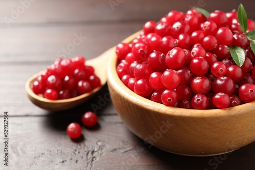 Fresh ripe cranberry on wooden table  closeup