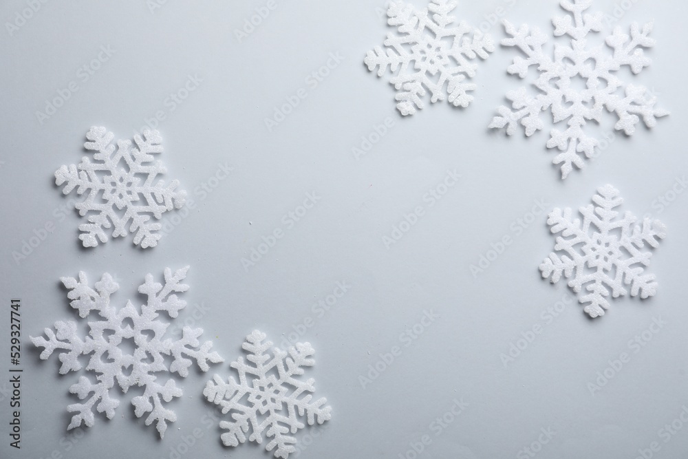 Beautiful snowflakes on white background, flat lay. Space for text Beautiful snowflakes on white background, flat lay. Space for text