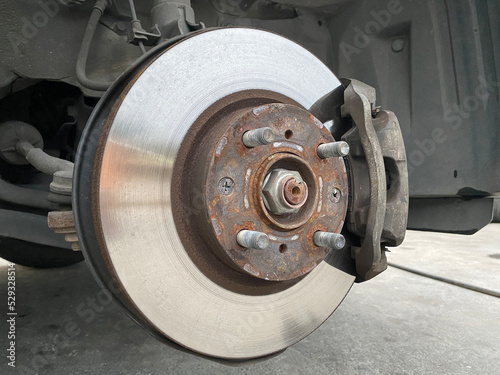 close up car brake disc, automobile service mechanic repair transportation.