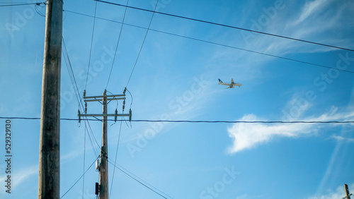 Powerlines, an Airplane and the sky