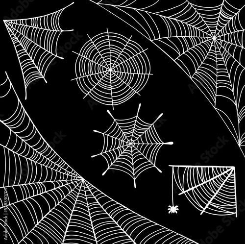 Spider web set - white on black background. Halloween design elements. Doodle line art. Creepy spiderwebs collection