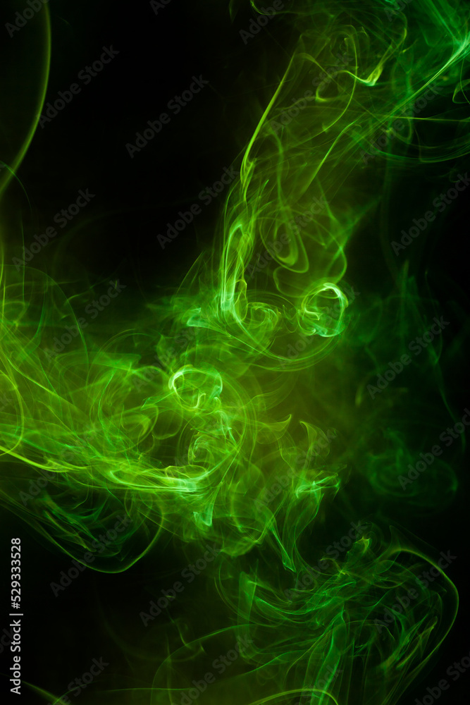 Fototapeta premium Green smoke motion on black background.