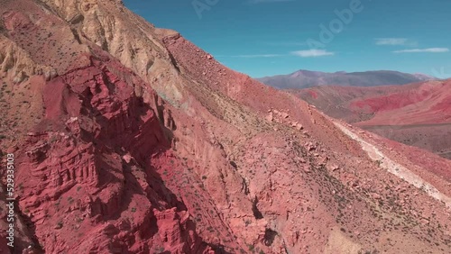 Flying Backwards Close Up Around Red Colored Mountains, North West Argentina photo