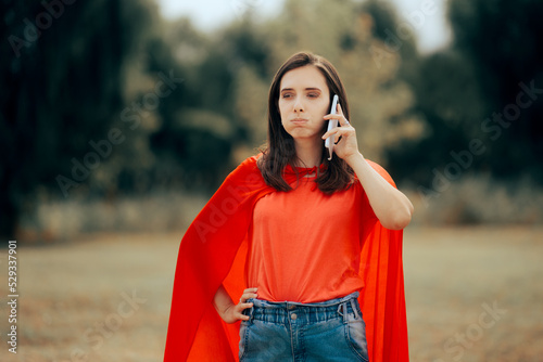Obraz na plátne Worried Superhero Woman Talking on the Phone