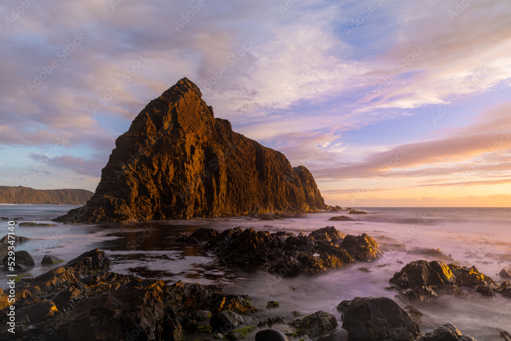 sunset shot of lion rock at south cape bay in the wilderness of south west national park sunset shot of lion rock at south cape bay in the wilderness of south west national park