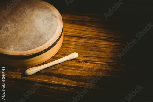 High angle view of bodhran with stick