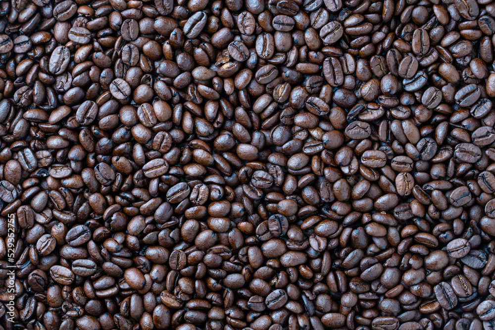 Background of fresh roasted coffee beans, close up, top view Background of fresh roasted coffee beans, close up, top view
