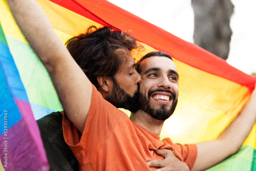 Obraz premium Happy couple with a pride flag. LGBT community.
