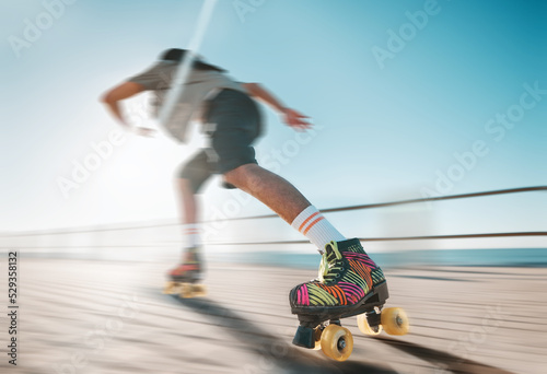 Obraz na plátně Freedom, speed and fitness, a woman on roller skates in the sun
