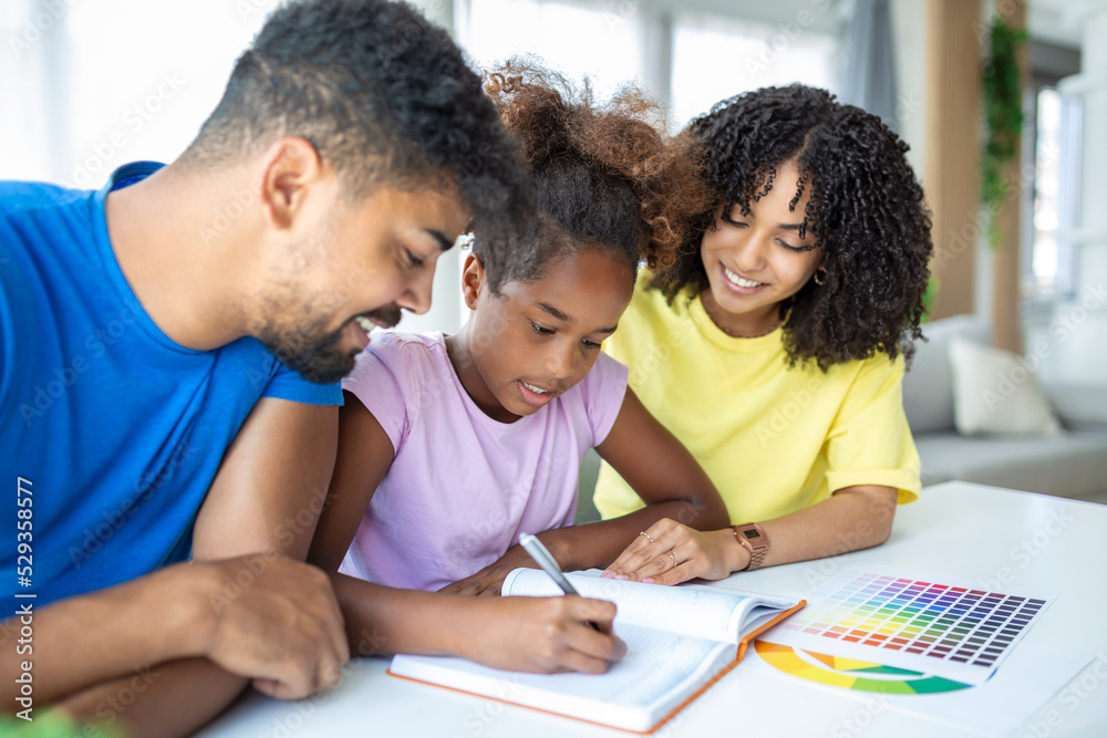 Parents helping child with her homework at home. Father and mother helping daughter studying at home. Parents helping child with her homework at home. Father and mother helping daughter studying at home.