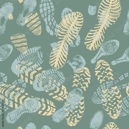 Vector seamless pattern color images double footprints yellow blue on green background