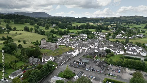 Drone, aerial footage of Hawkshead a ancient Village in the Lake District, Cumbria.
The village is still the same collection of tiny houses, and squares loved by Wordsworth and Beatrix Potter. England photo