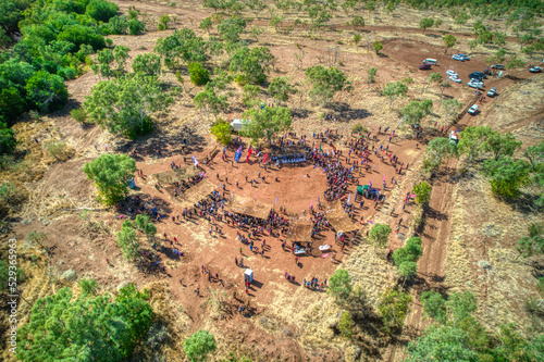 Aerial view of people gathering at the ceremony site along the Victoria River after the Freedom Day Festival march in Kalkaringi in the Northern Territory, Australia on on 26/08/22.