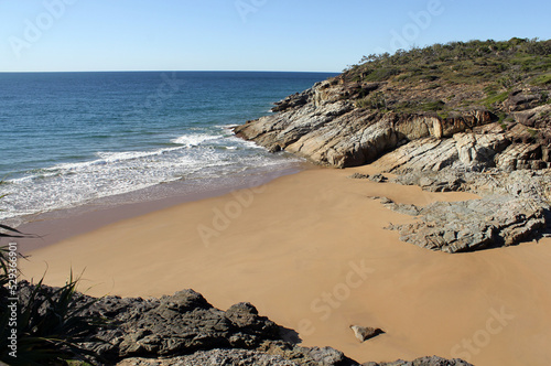 Beach, sand, ocean and cliff at Seventeen Seventy in Queensland, Australia