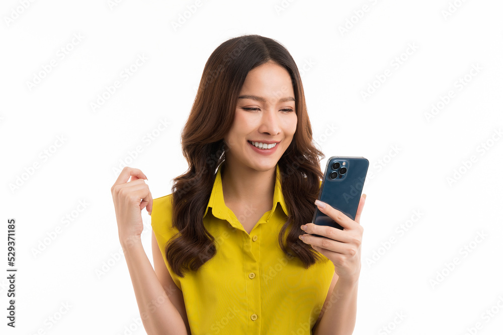 Asian woman in green shirt posing isolated on white background studio portrait. People lifestyle concept. Mock up copy space. Using smartphone shopping online. Asian woman in green shirt posing isolated on white background studio portrait. People lifestyle concept. Mock up copy space. Using smartphone shopping online.